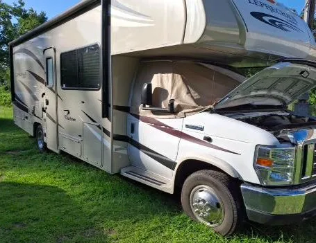 Class C motorhome parked on grass during a real GrabATech wiring repair